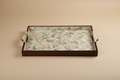 High-end studio product shot of a rectangular serving tray with Mother of Pearl inlay on a clean beige background. The tray is empty to show the shell pattern. Soft studio lighting, sharp focus, minimal shadows, luxury catalog style, 8K.